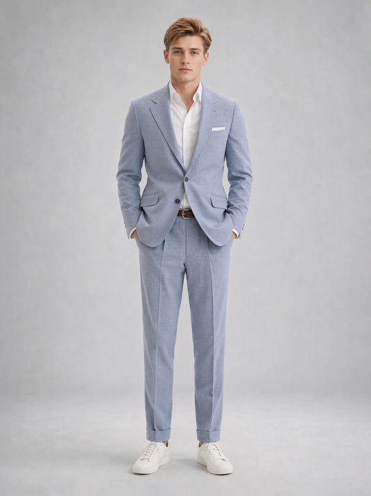 Savile GA0082 powder blue linen suit set – back view showing side vents, structured shoulders and slim turn-up trouser silhouette with white sneakers