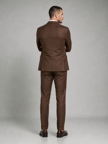 Savile GA0083 chocolate brown wool suit – full body front view, hand in pocket with dark brown brogue oxfords showing slim silhouette and turn-up cuffs