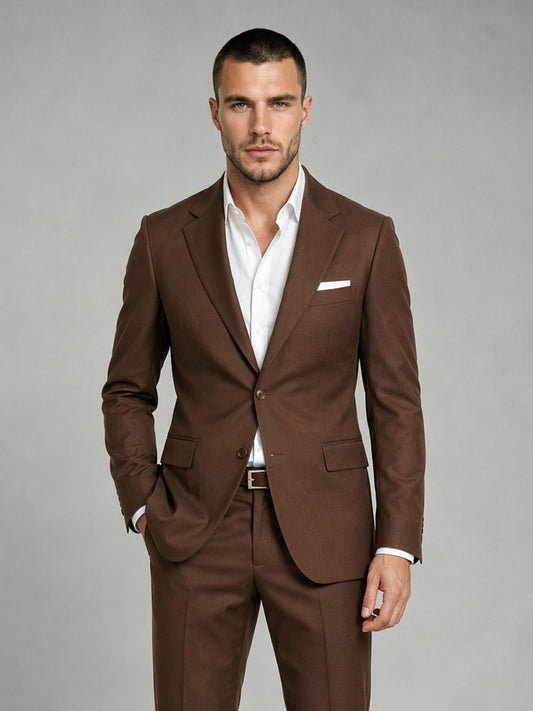 Savile GA0083 chocolate brown wool 2-piece suit – full body front view, arms crossed showing structured notch lapel silhouette and slim turn-up trouser drape