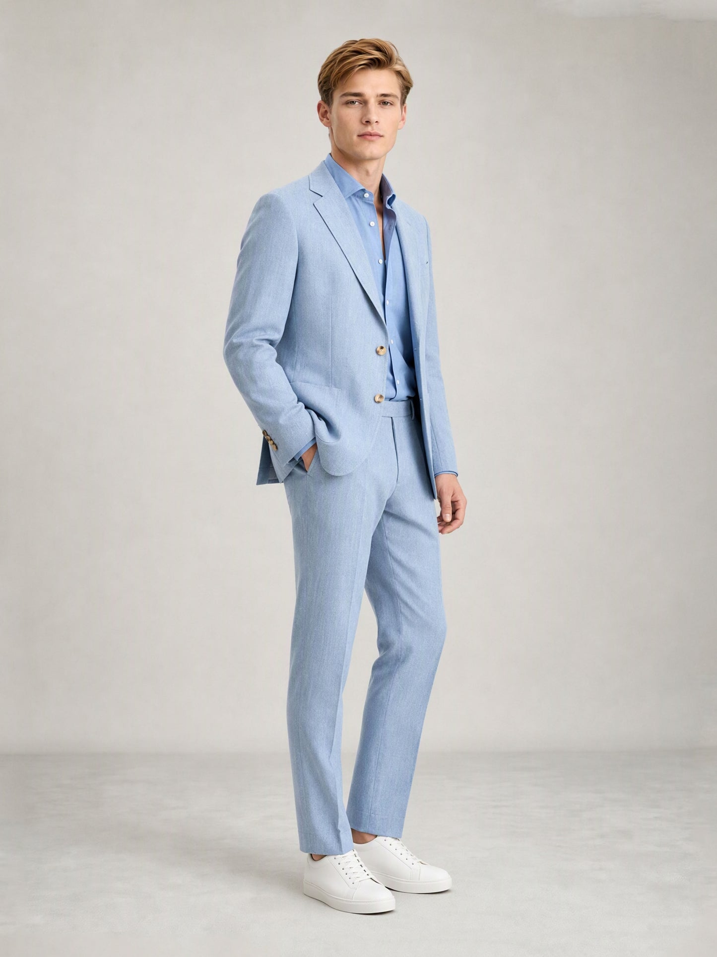 Savile GA0084 ice blue linen suit set – back view showing side vents, structured notch lapel shoulders and slim trouser drape with white sneakers