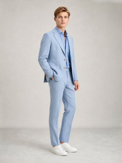 Savile GA0084 ice blue linen suit set – back view showing side vents, structured notch lapel shoulders and slim trouser drape with white sneakers