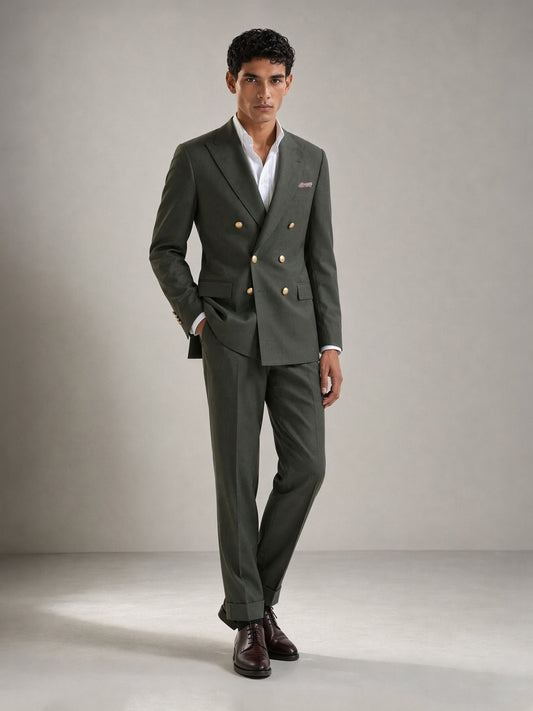 Savile GA0087 olive green wool 2-piece suit set – full body front view, hands clasped showing slim silhouette, turn-up trouser cuffs and dark brown brogue oxfords