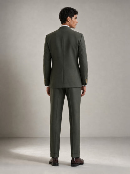 Savile GA0087 olive green double-breasted suit – full body front view, hand in pocket showing Italian drape, peak lapel profile and turn-up trouser cuffs