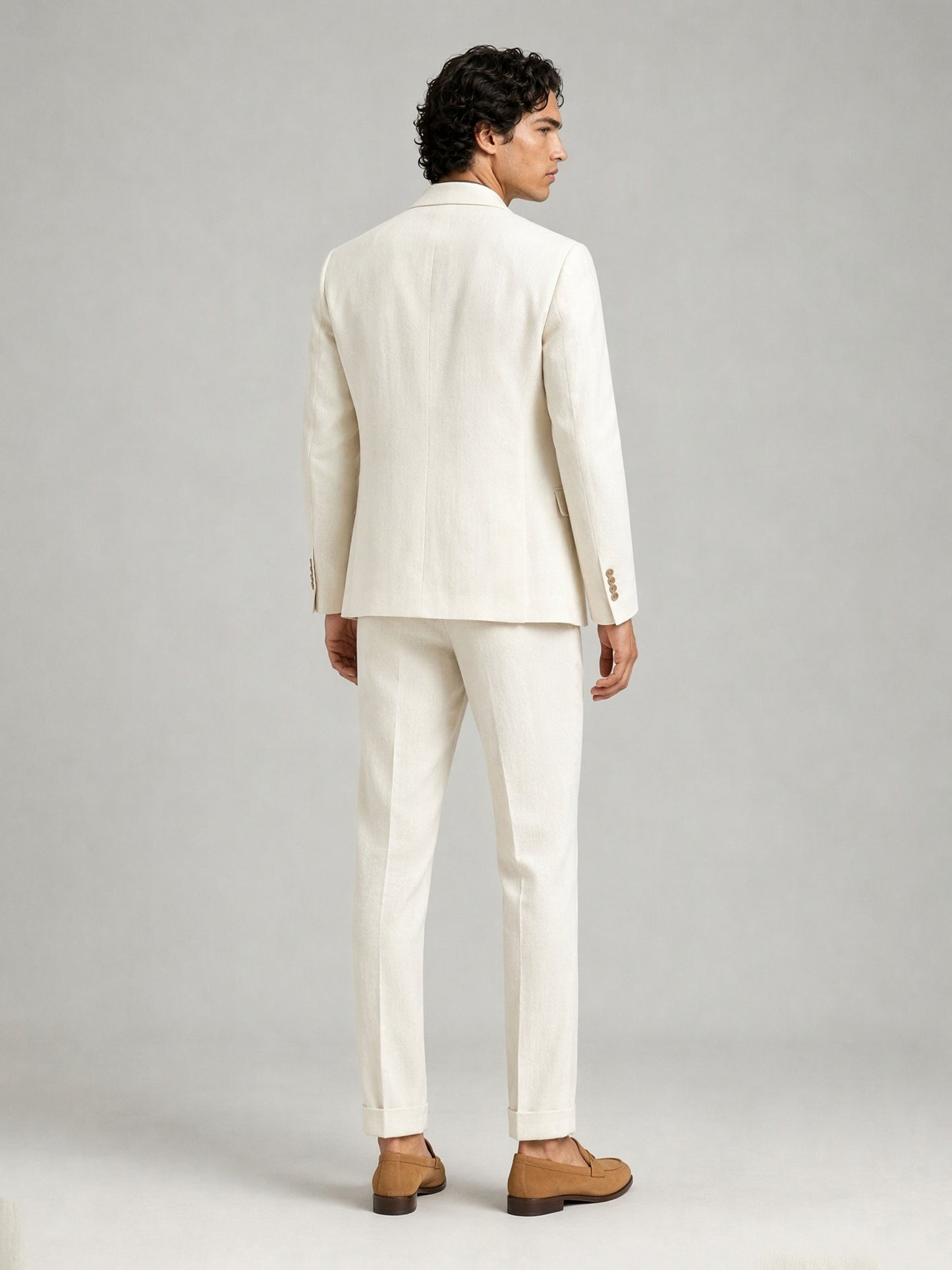 Savile GA0088 cream ivory linen suit – full body front view, hands clasped showing slim silhouette, turn-up trouser cuffs and tan suede tassel loafers