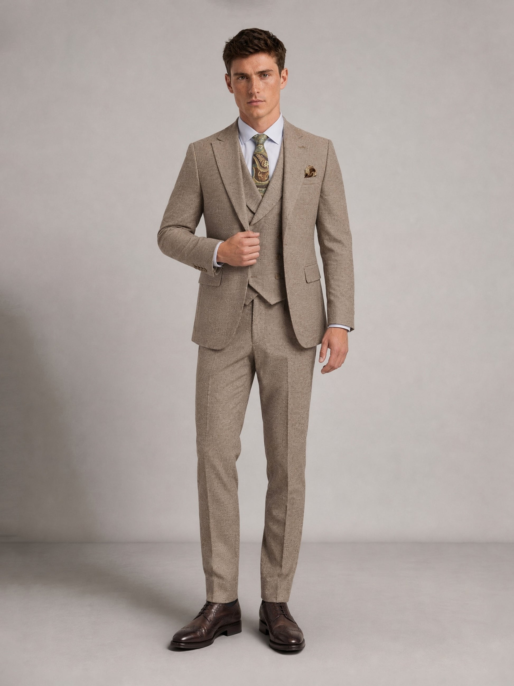 Savile GA0091 warm sand micro-check wool 3-piece suit set – full body front view, hand in pocket with dark brown brogue oxfords showing complete three-piece silhouette
