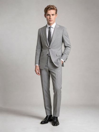 Savile GA0092 light grey wool suit – full body front view, hand in pocket with black brogue oxfords, white shirt and dark grey geometric tie