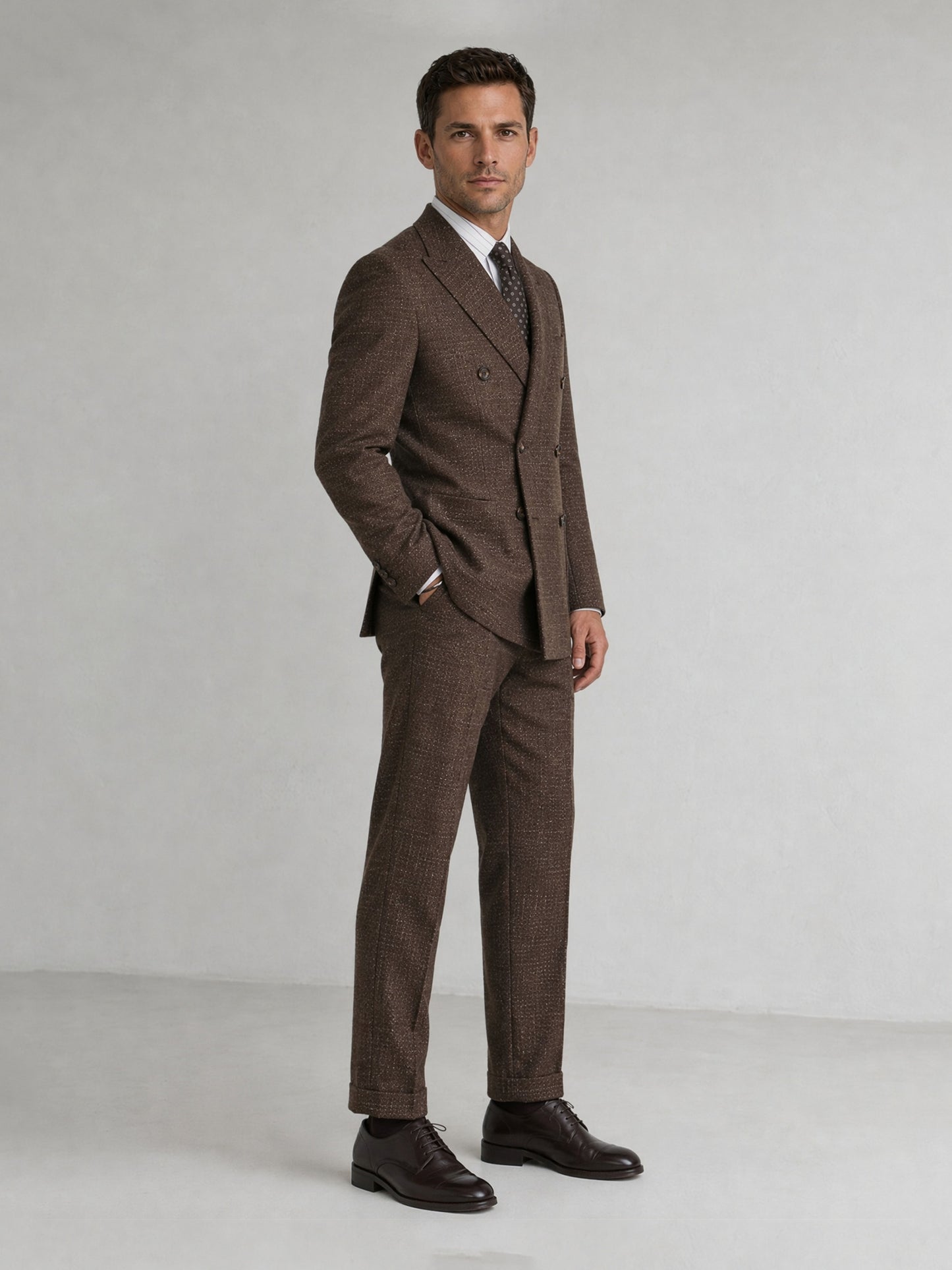 Savile GA0093 tobacco brown check suit set – back view showing center vent, structured peak lapel shoulders and slim trouser drape with dark brown oxfords