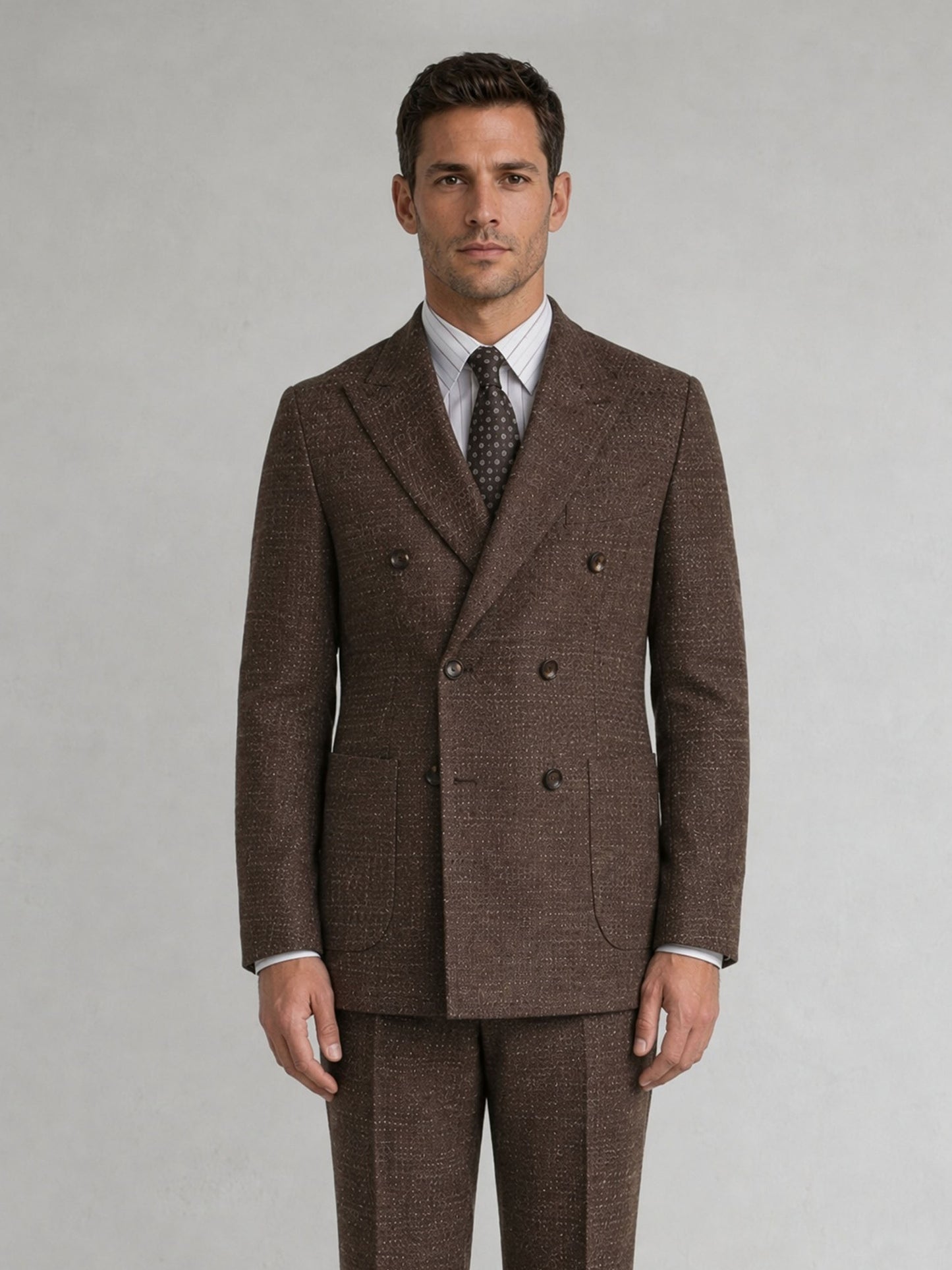 Savile GA0093 tobacco brown melange check wool suit – full body three-quarter side pose, hand in pocket showing Italian tailoring silhouette and slim trouser profile