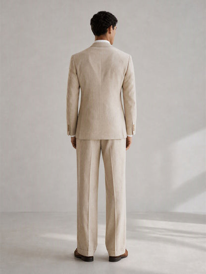 Savile GA0094 natural beige linen relaxed suit – full body front view, arms crossed showing Neapolitan relaxed-fit blazer and wide-leg turn-up trouser silhouette