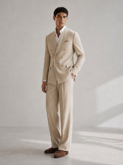 Savile GA0094 natural beige linen suit set – back view showing center vent, soft unpadded shoulders and wide-leg turn-up trouser drape with dark brown suede loafers
