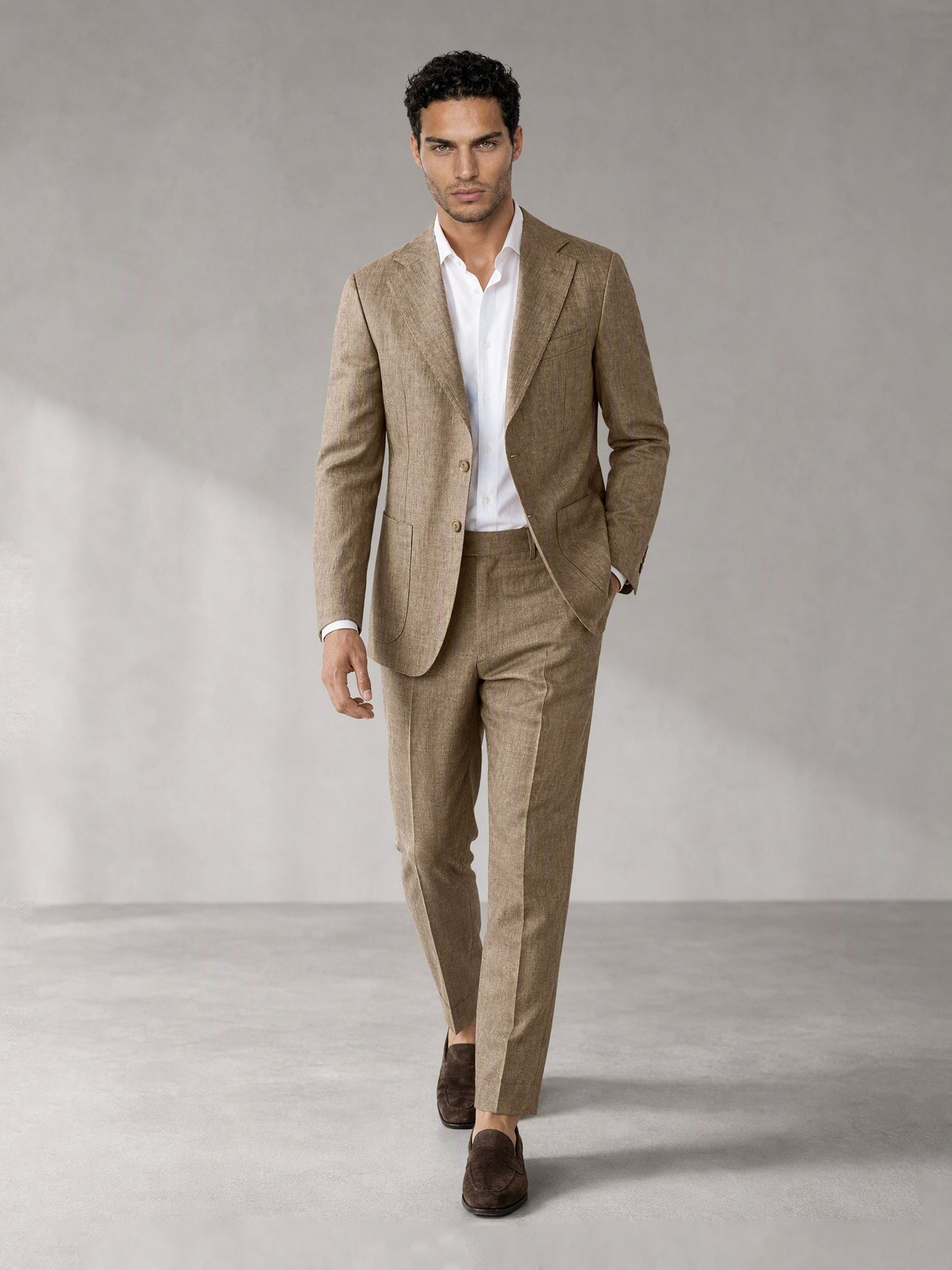 Savile camel linen suit – three-quarter front view, walking