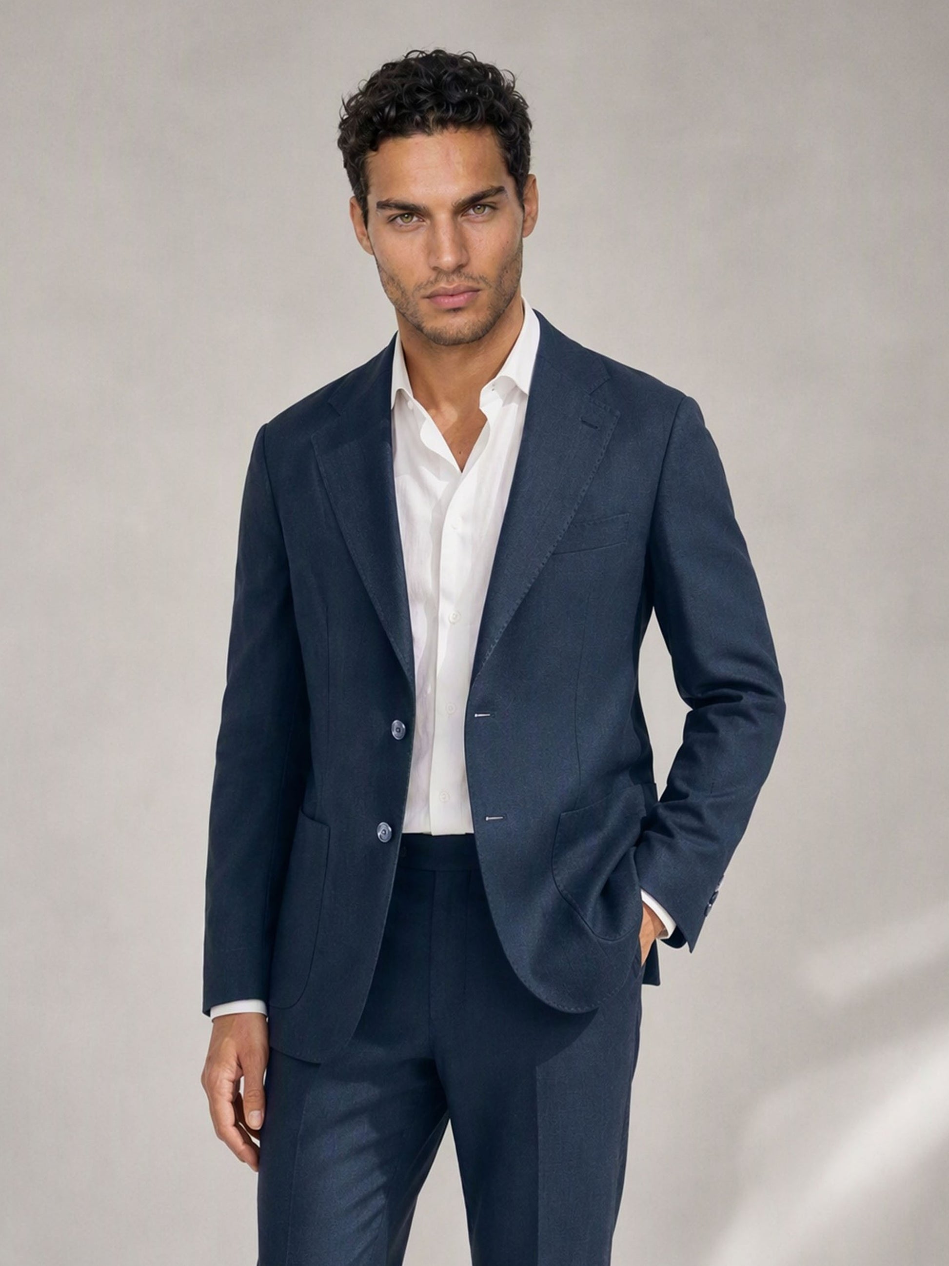Savile navy linen suit – full-length front view, hand in pocket