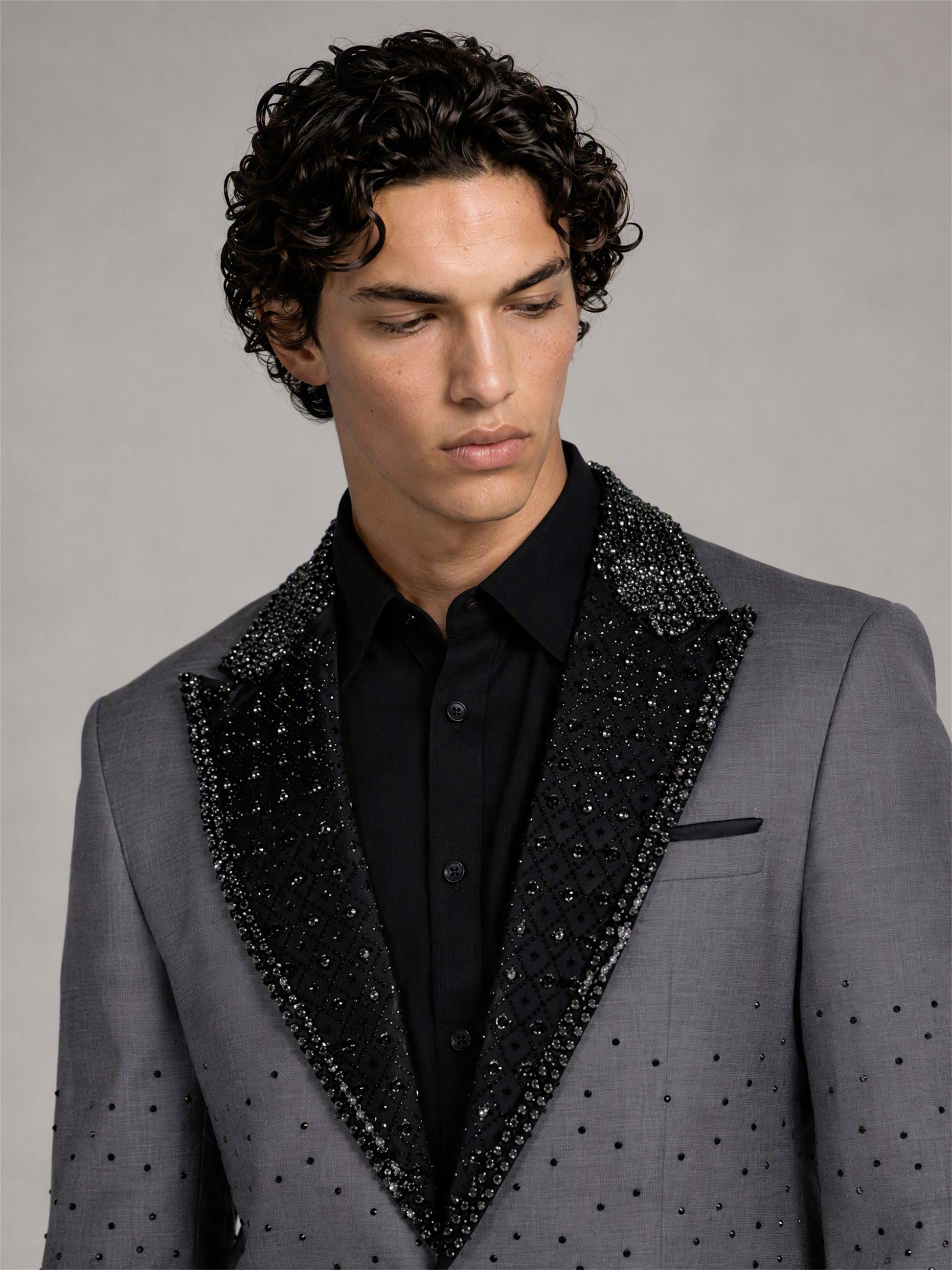 Savile grey rhinestone suit – close-up upper body detail, black crystal peak lapels