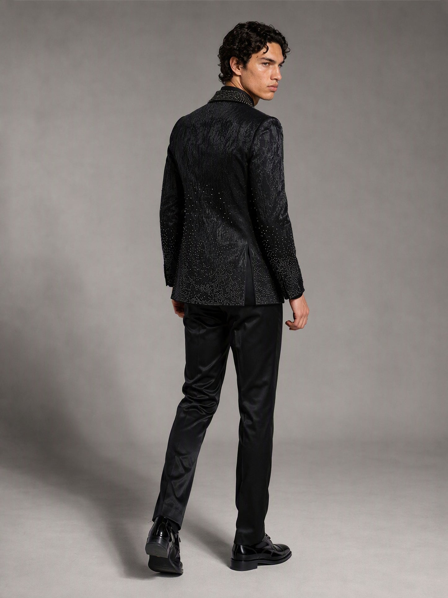 Savile black jacquard rhinestone suit – full-length front view, hand in pocket