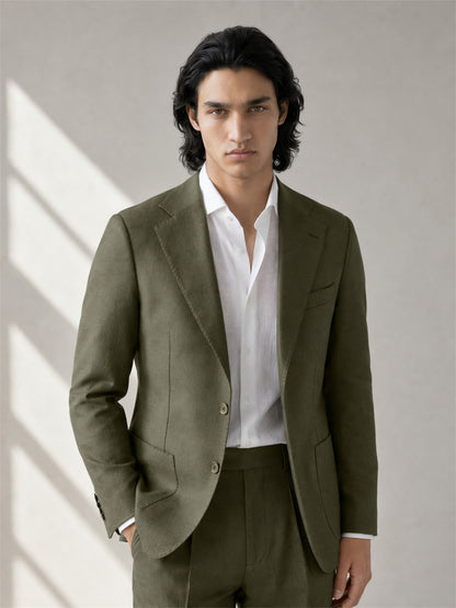 Savile olive green linen suit – full-length walking shot, natural light