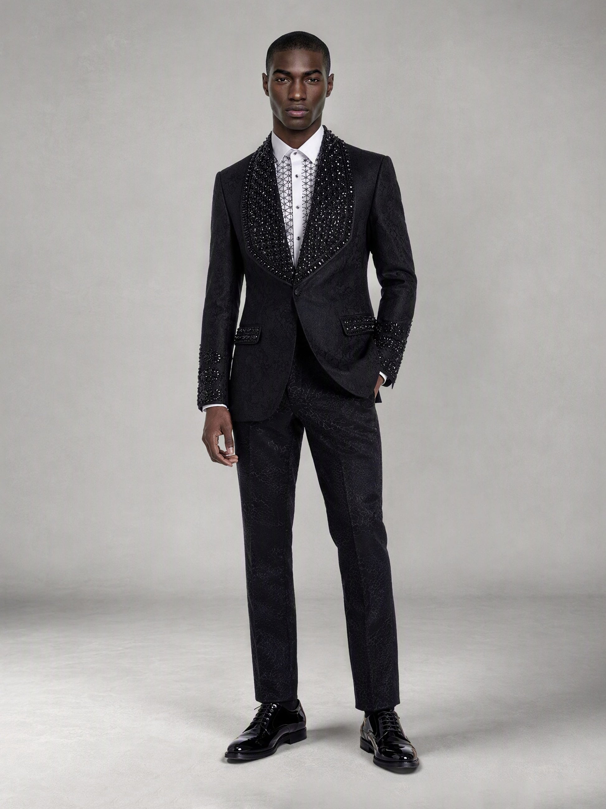 Savile black jacquard crystal shawl lapel suit – close-up upper body, rhinestone lapel and cuff detail
