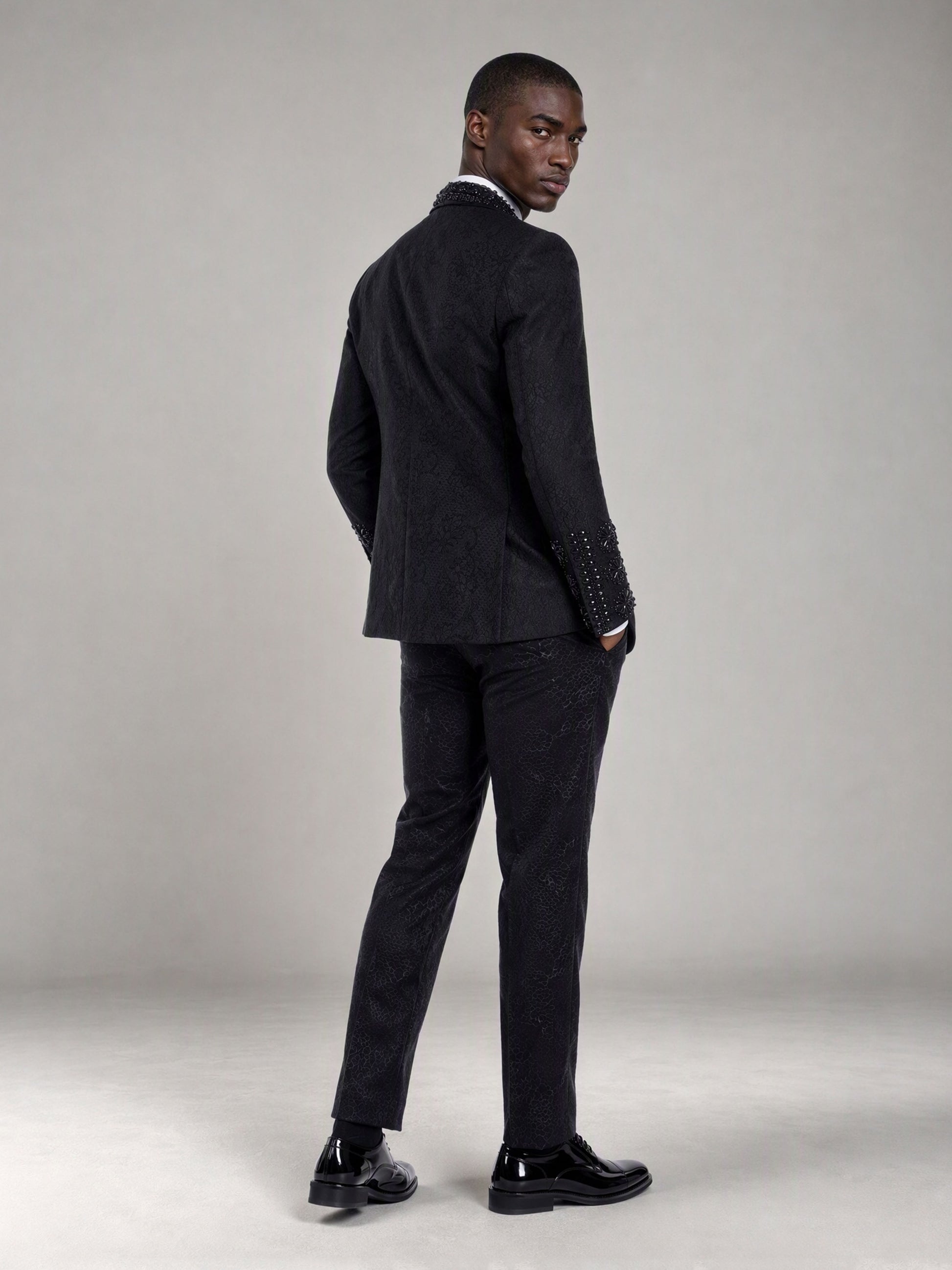Savile black jacquard crystal shawl lapel suit – back view showing rhinestone cuffs and jacquard trousers