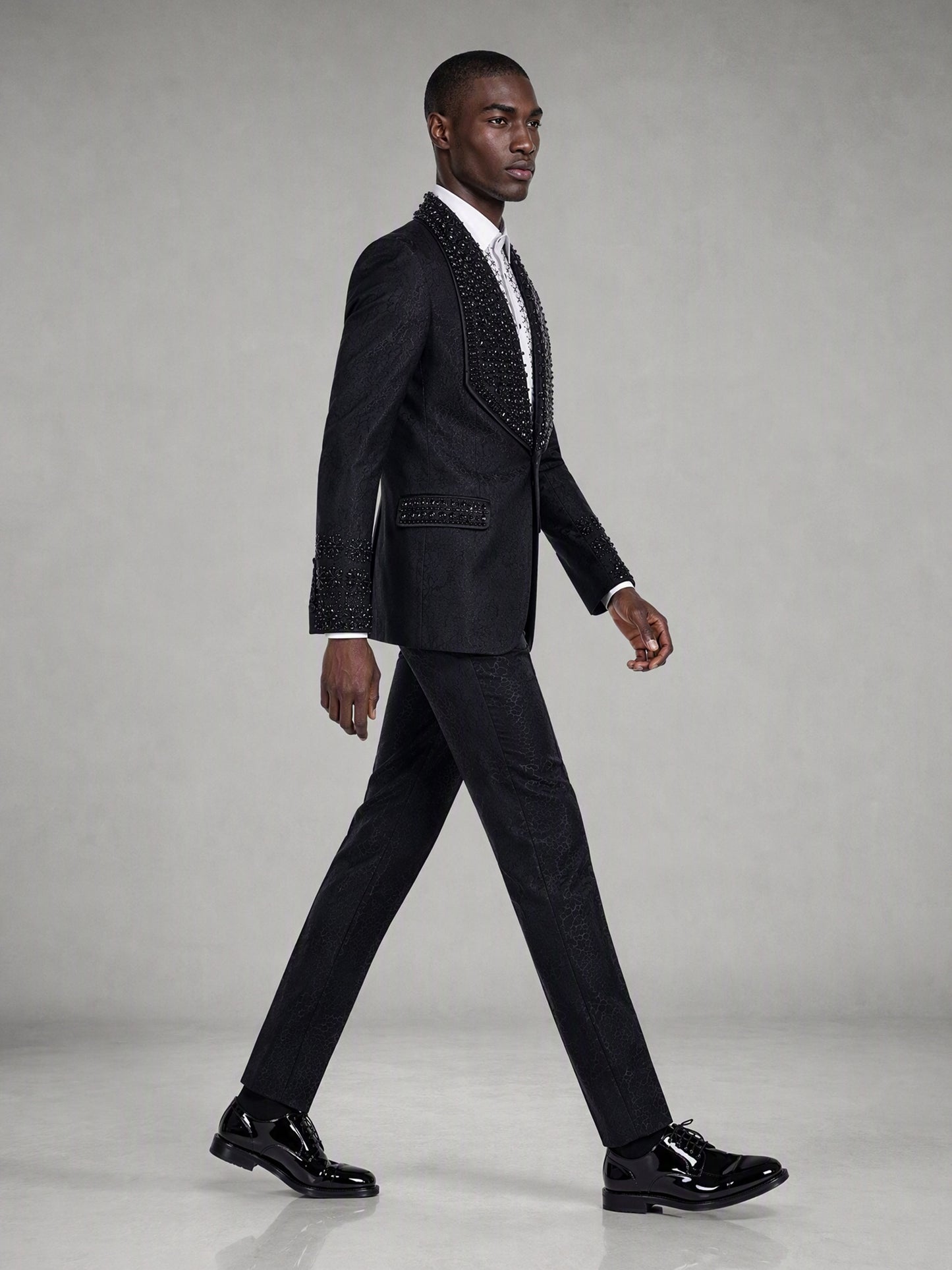 Savile black jacquard crystal shawl lapel suit – full-length front view, hands clasped