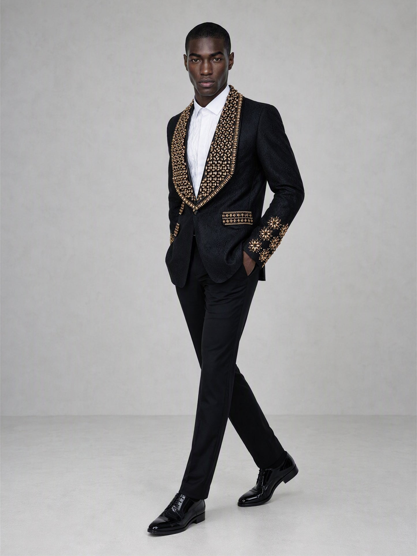 Savile black jacquard gold crystal suit – close-up upper body, gold crystal shawl lapel and cuff medallion detail