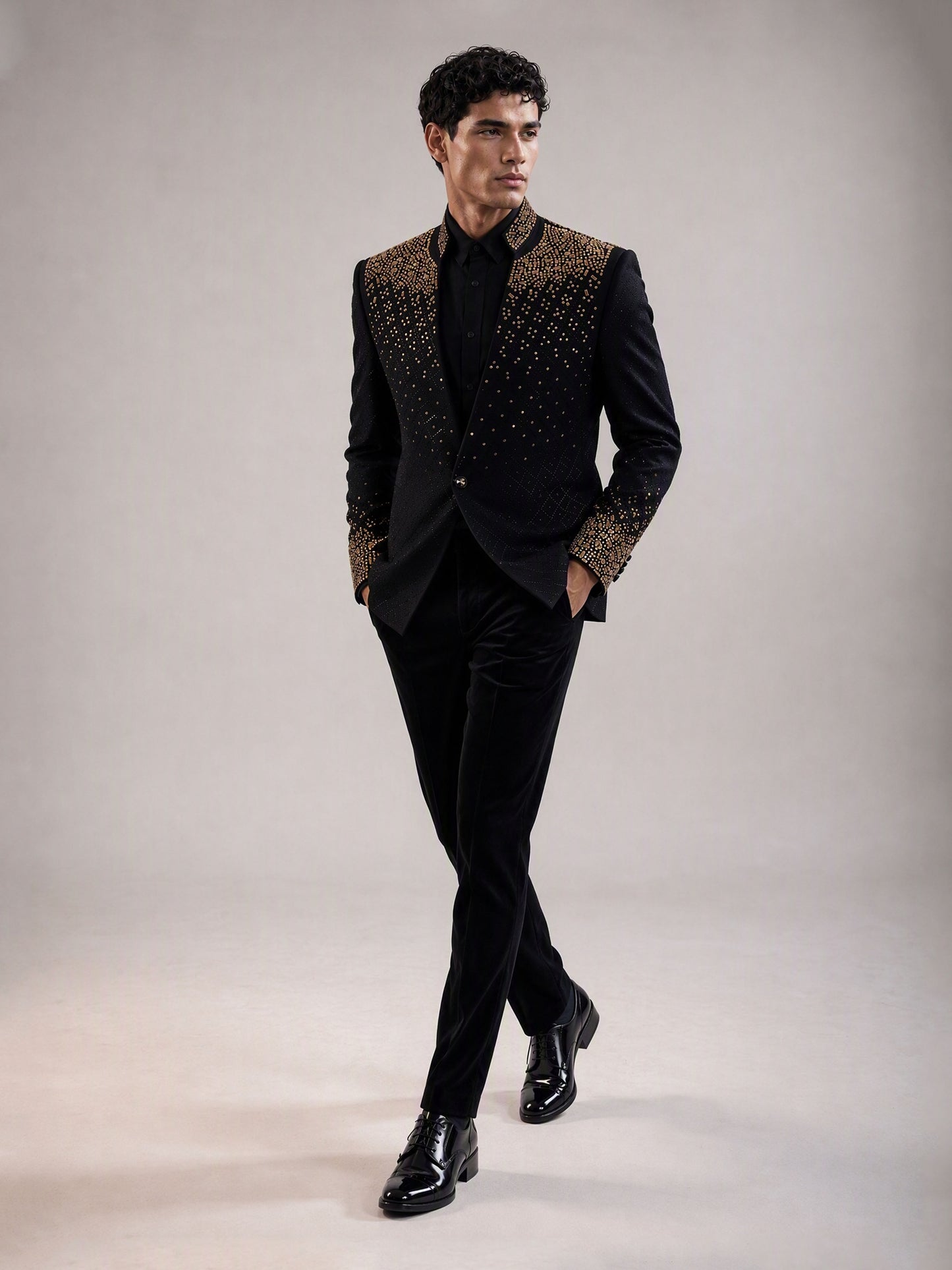 Savile black gold gradient crystal suit – full-length walking shot, side profile showing silhouette and crystal detail