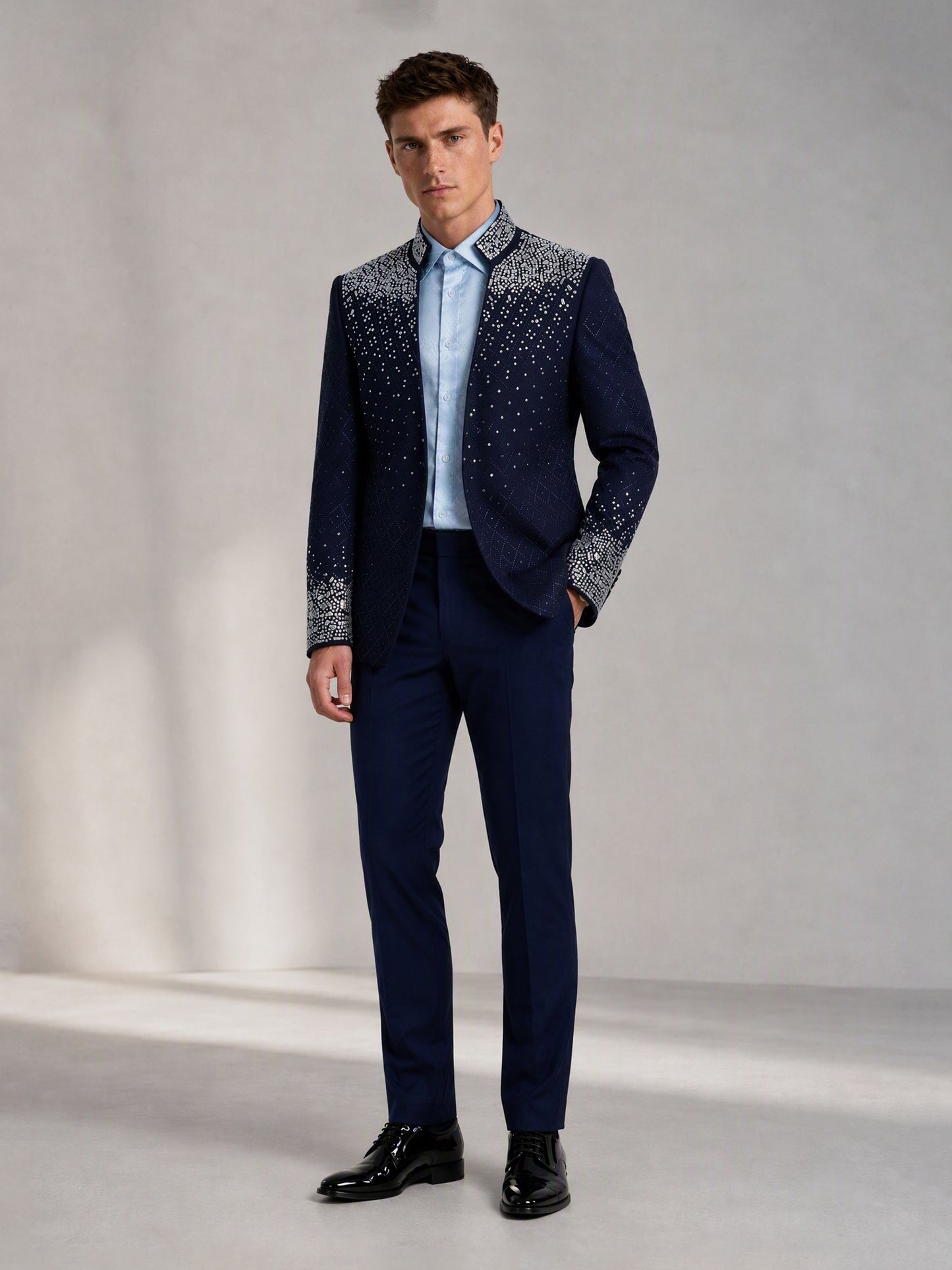 Savile navy blue silver crystal suit – full-length front view, hand at side showing shoulder-to-chest crystal cascade