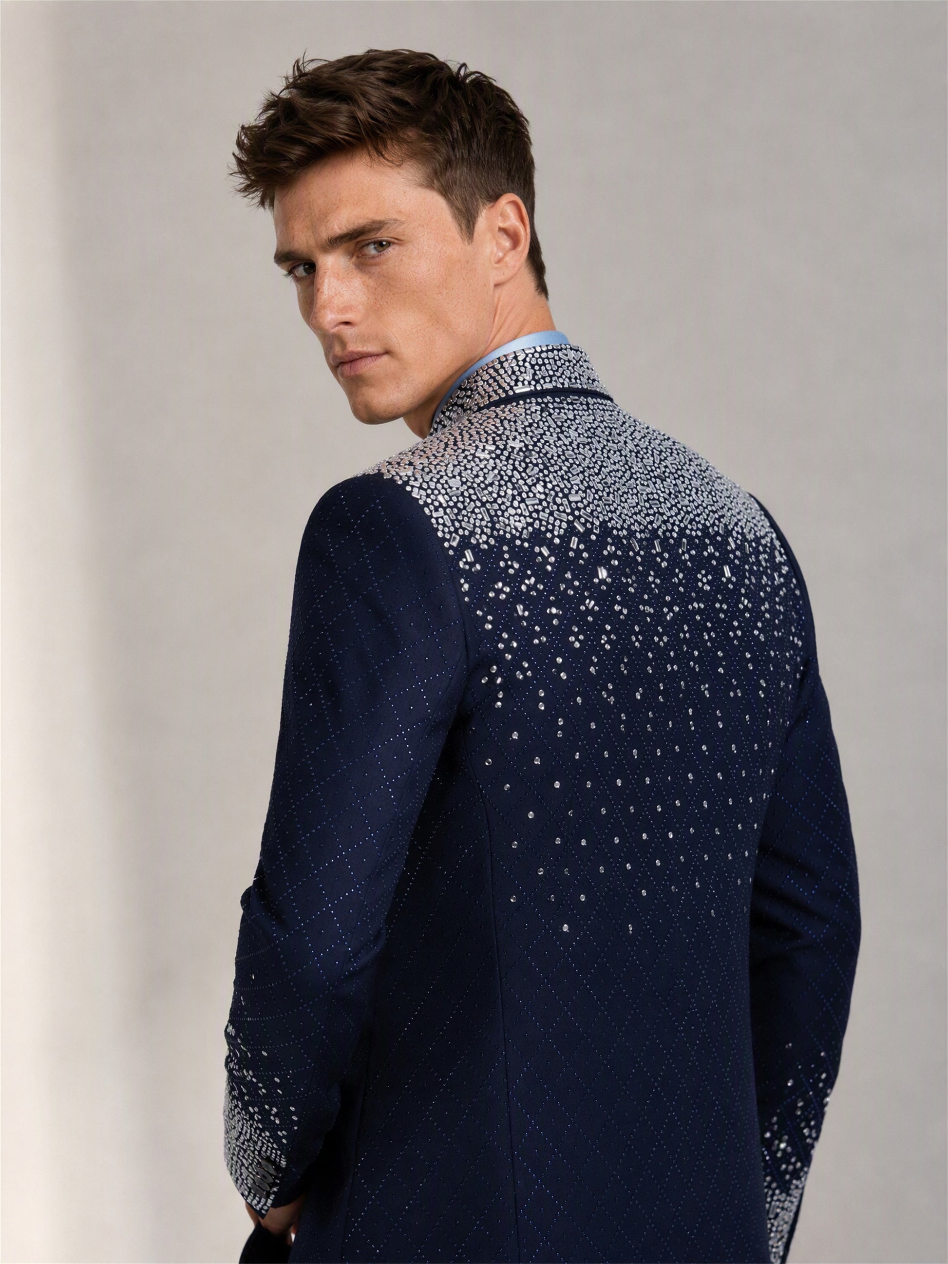 Savile navy blue silver crystal suit – back view showing silver gradient crystal cascade across upper back and shoulders