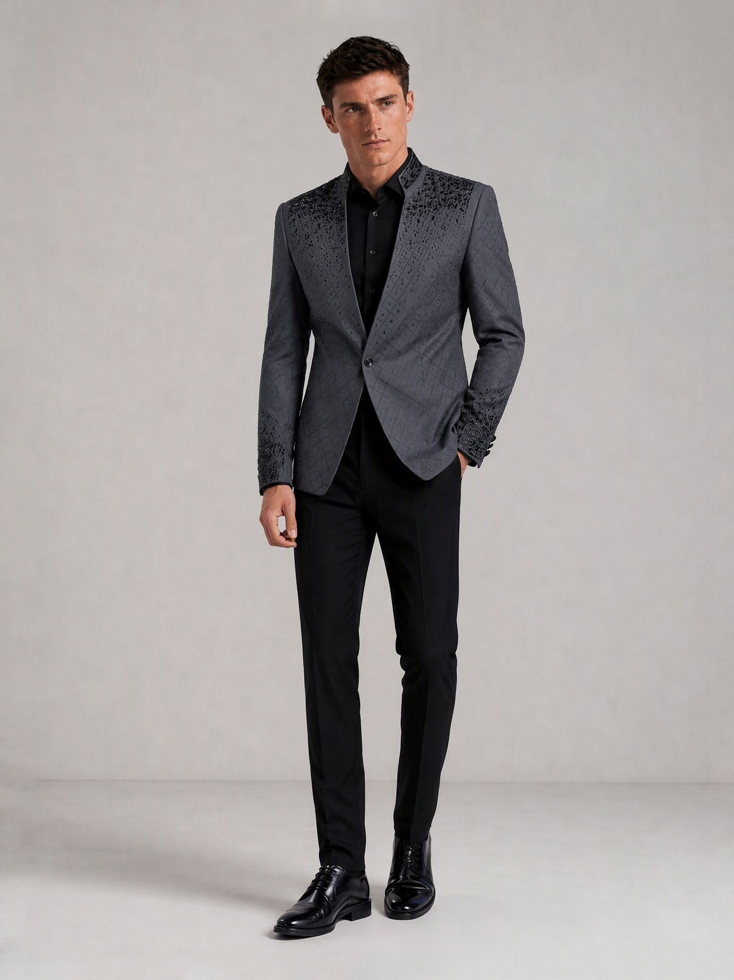 Savile charcoal plaid jacquard black crystal suit – full-length front view, hand at side showing cuff crystal detail