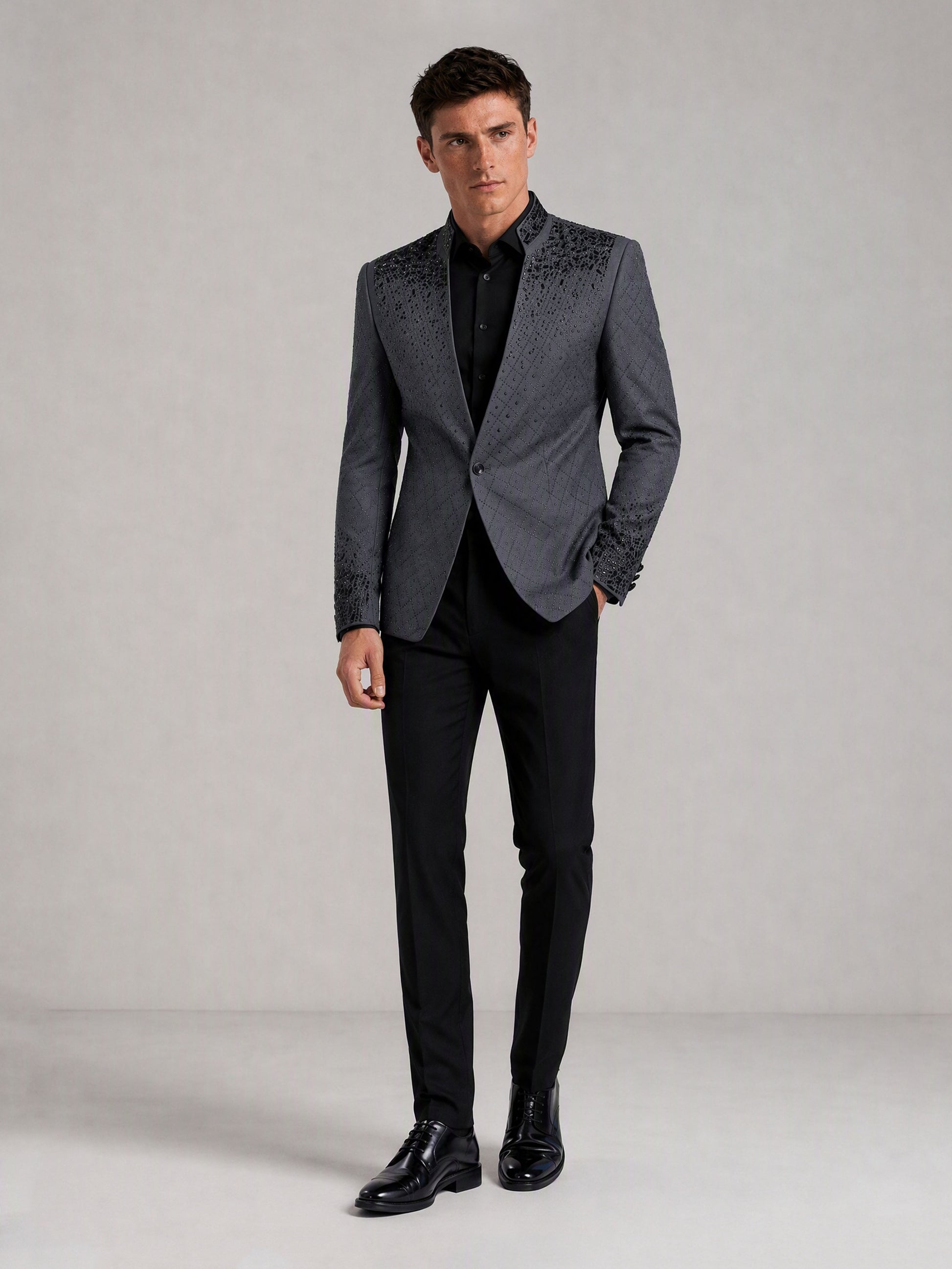 Savile charcoal plaid jacquard black crystal suit – full-length front view, hand at side showing cuff crystal detail