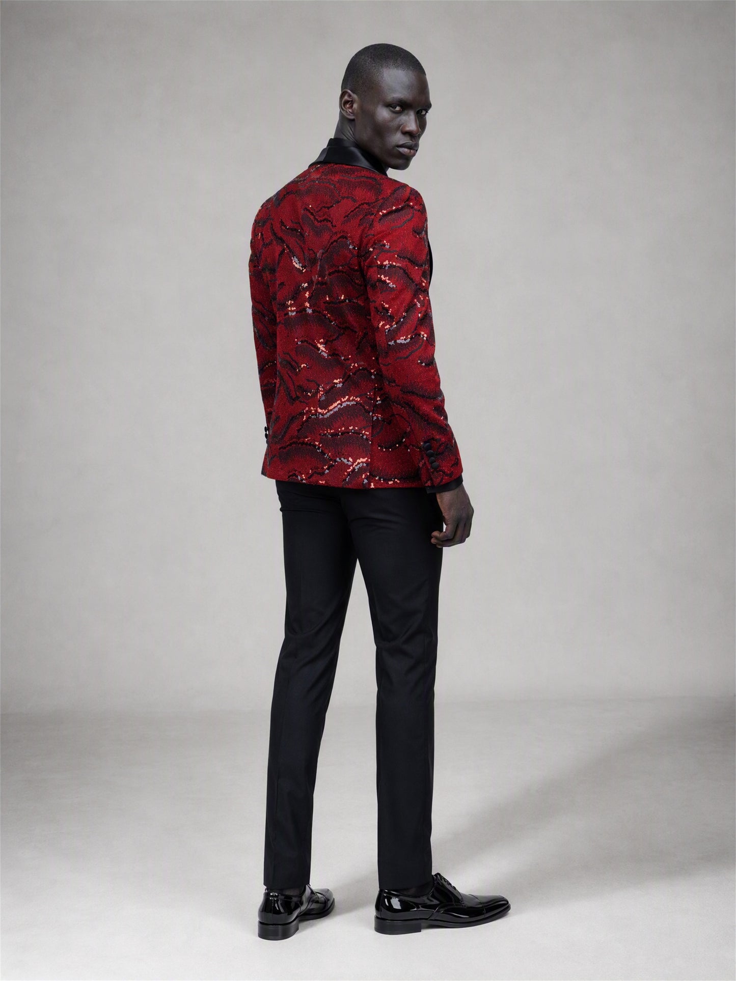 Savile red velvet sequin suit – full-length front view, standing straight showing complete cloud sequin pattern and black trousers