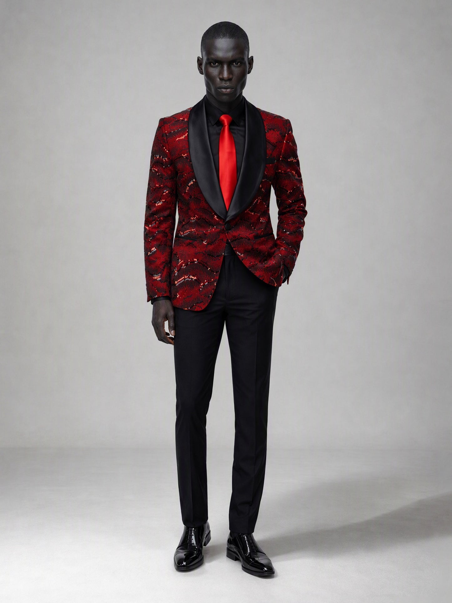 Savile red velvet sequin suit – full-length front view, hand in pocket showing red-on-black contrast