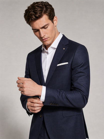 Savile navy blue business suit – full-length front view, open-collar white shirt and brown monk-strap shoes