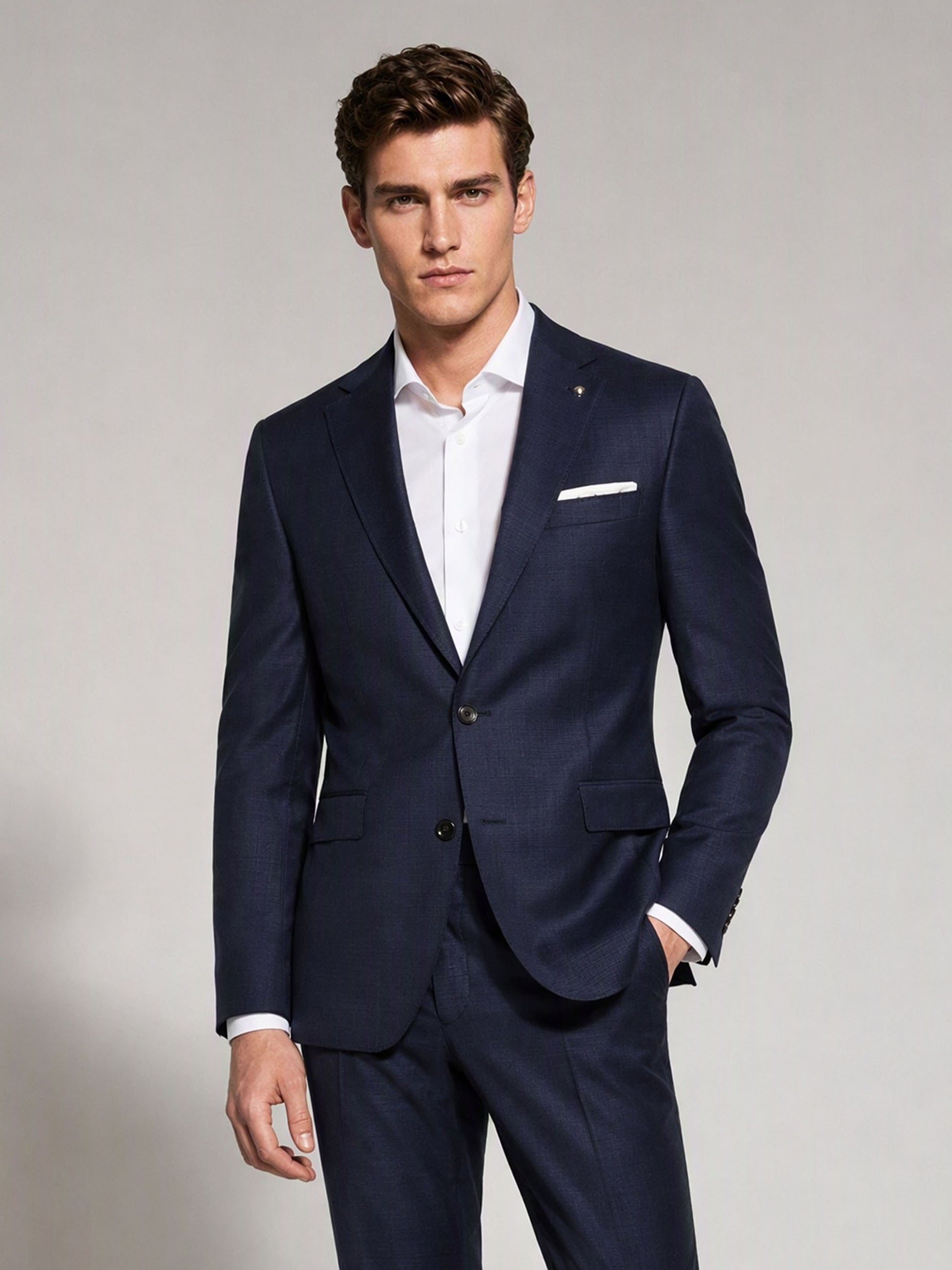 Savile navy blue business suit – back view showing center vent, structured shoulder and tapered trouser