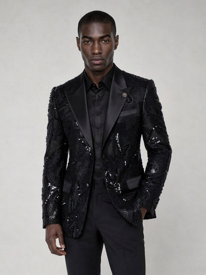 Savile black sequin floral suit – close-up upper body, black sequin botanical embroidery and satin peak lapel with silver brooch