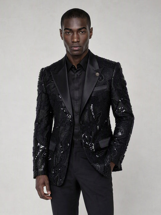Savile black sequin floral suit – close-up upper body, black sequin botanical embroidery and satin peak lapel with silver brooch