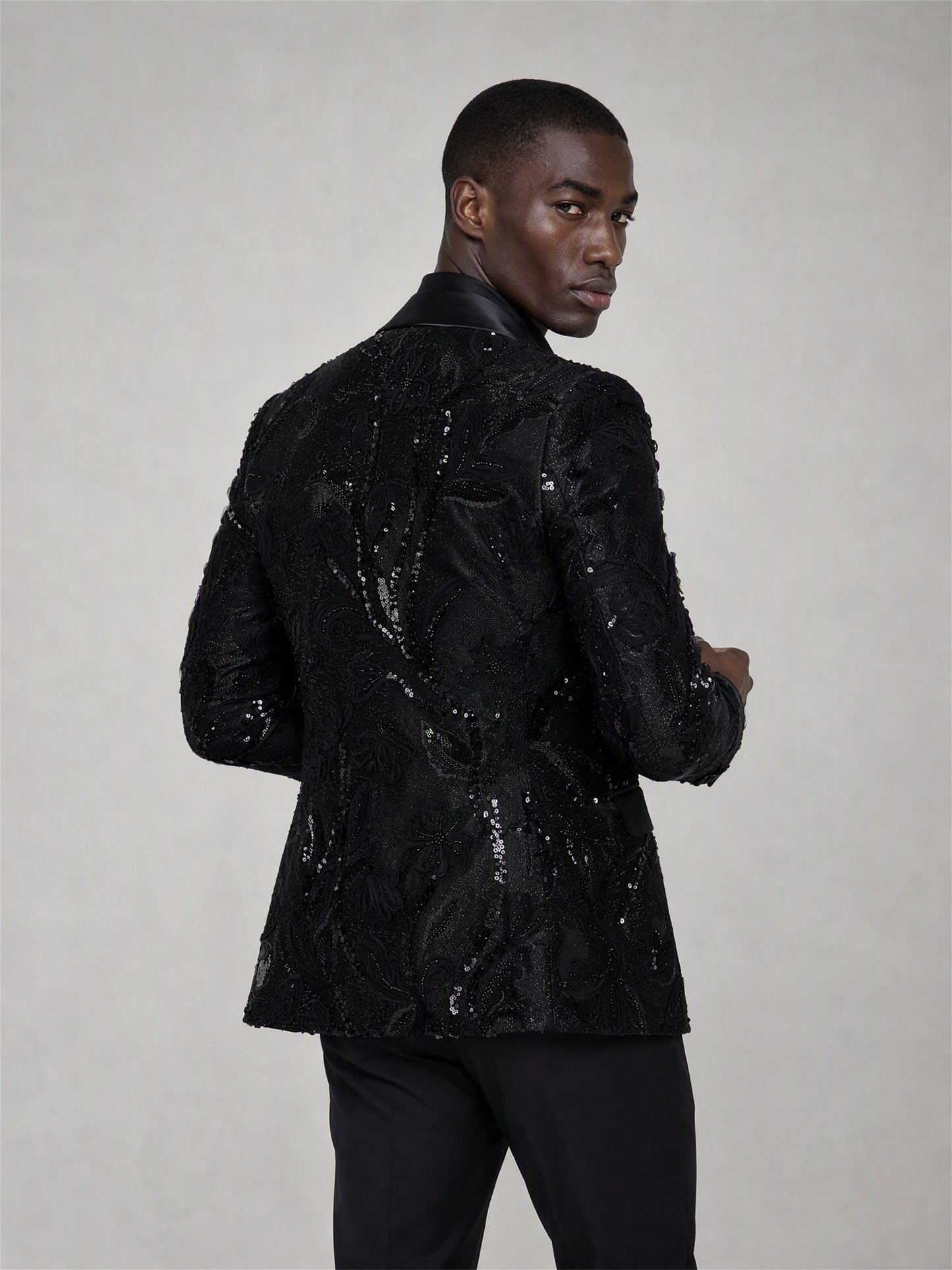 Savile black sequin floral suit – back view showing all-over floral sequin embroidery pattern and center vent
