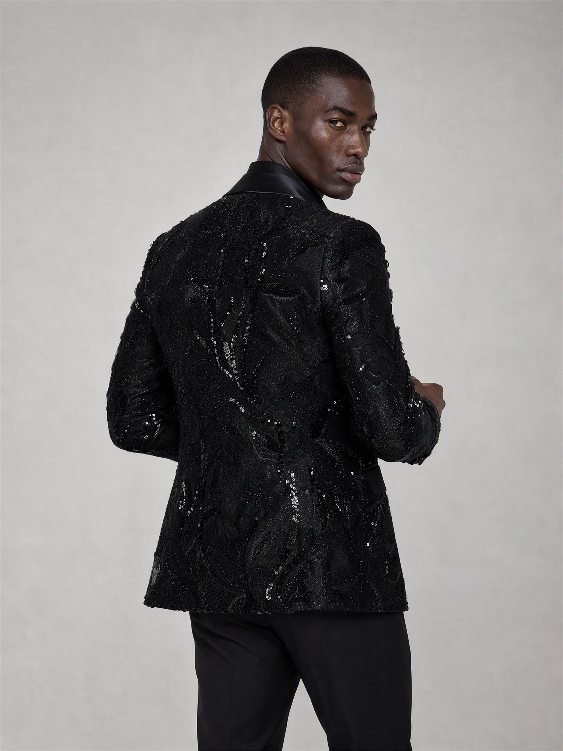 Savile black sequin floral suit – back view showing all-over floral sequin embroidery pattern and center vent