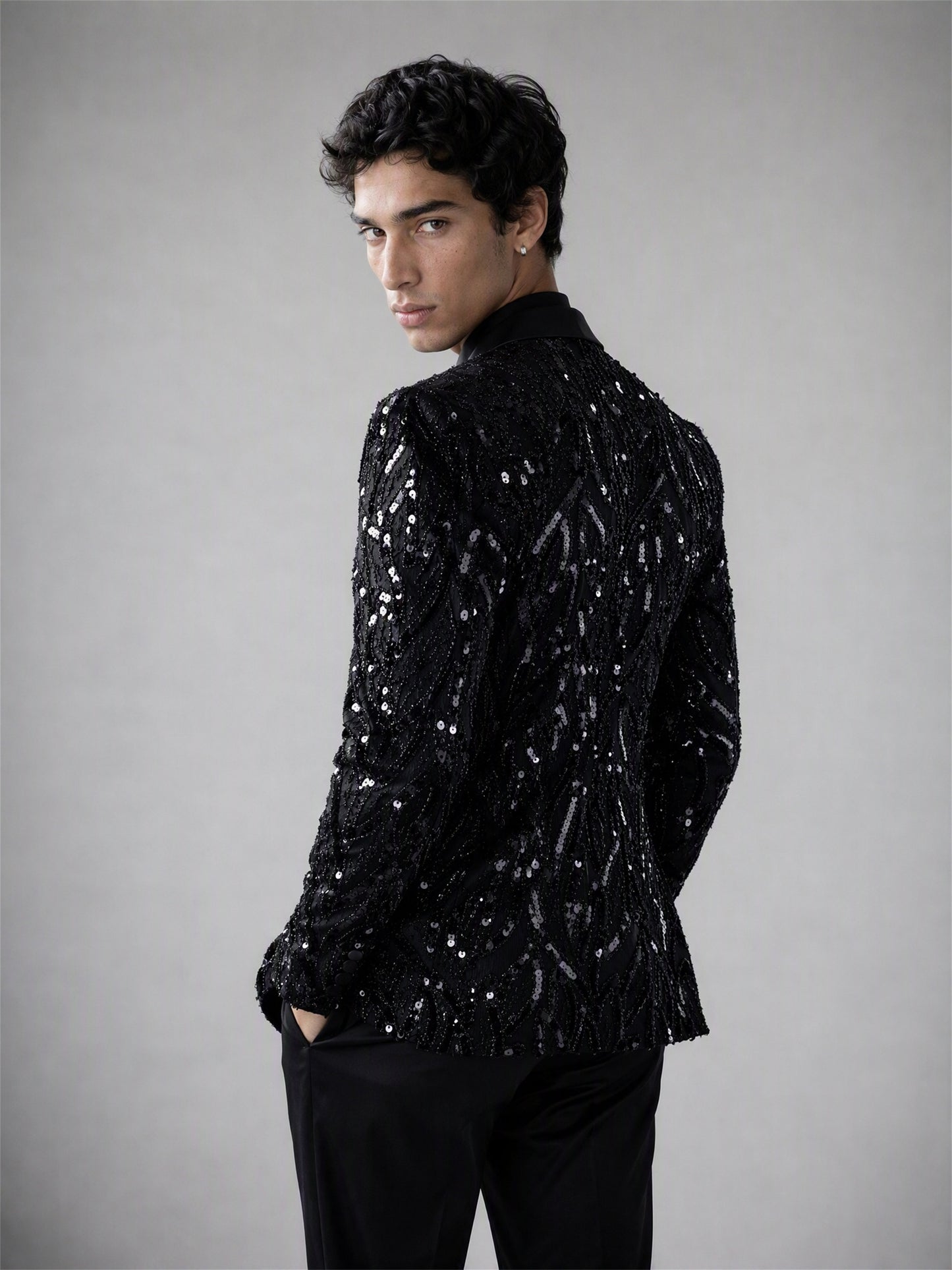 Savile black Art Deco sequin suit – upper body front view, silver sequin and black bugle bead geometric pattern detail