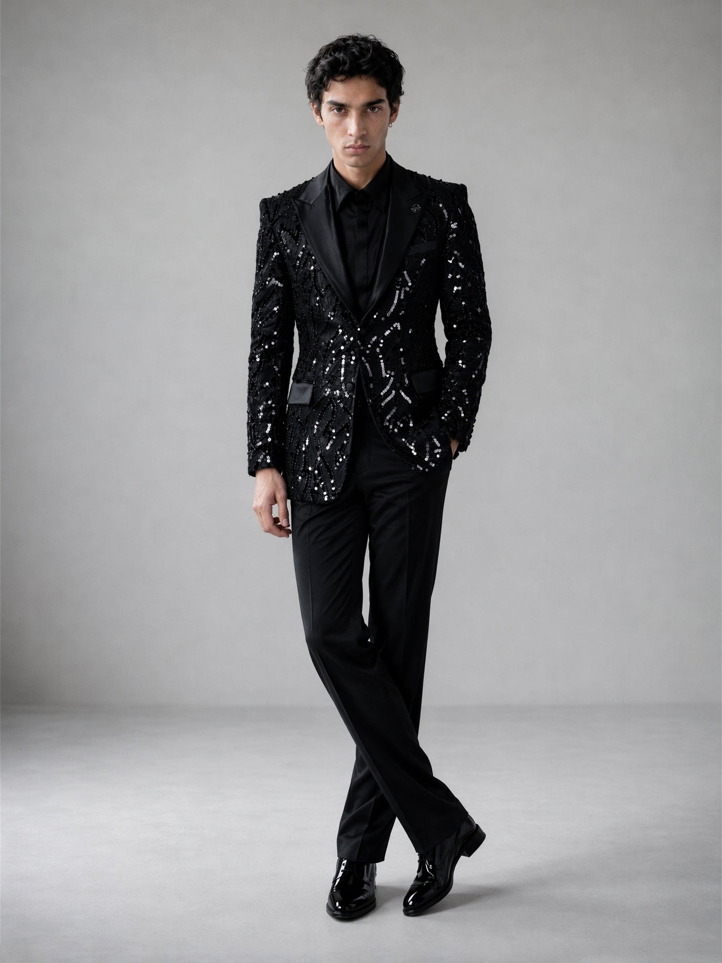 Savile black Art Deco sequin suit – full-length front view, standing straight showing complete geometric pattern and black trousers