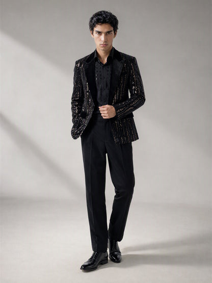 Savile black velvet sequin stripe suit – three-quarter side view, silver sequin stripes catching light and floral-beaded shirt detail