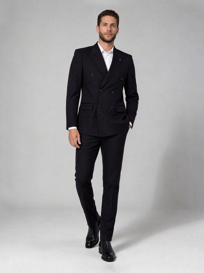 Savile black velvet chalk stripe double-breasted suit – full-length side walking shot showing chalk stripe trousers and Chelsea boots