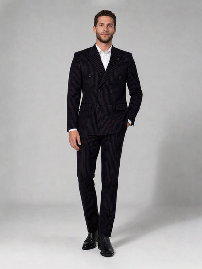 Savile black velvet chalk stripe double-breasted suit – full-length front view, hand in pocket showing complete chalk stripe silhouette