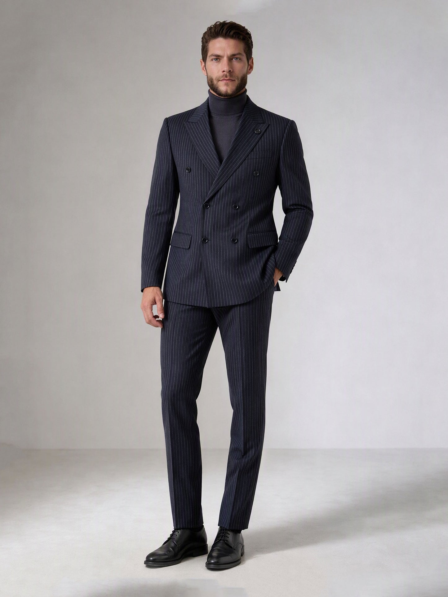 Savile navy blue chalk stripe double-breasted suit – close-up upper body, wide peak lapels, badge pin and chalk stripe texture detail