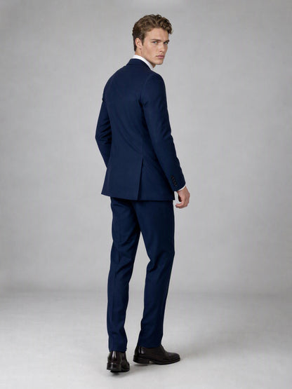 Savile deep navy double-breasted suit – full-length front view, standing straight showing wide peak lapels, navy tie and tonal navy buttons