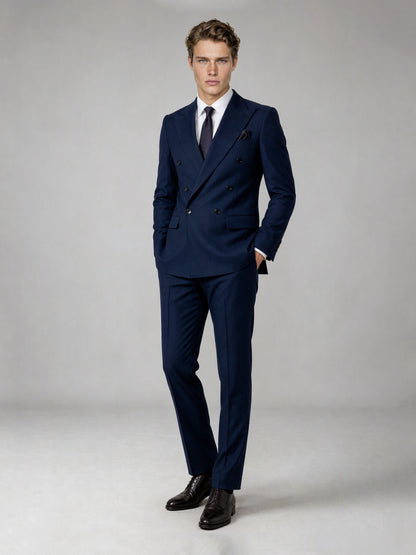 Savile deep navy double-breasted suit – full-length front view, one hand in pocket showing authoritative double-breasted silhouette