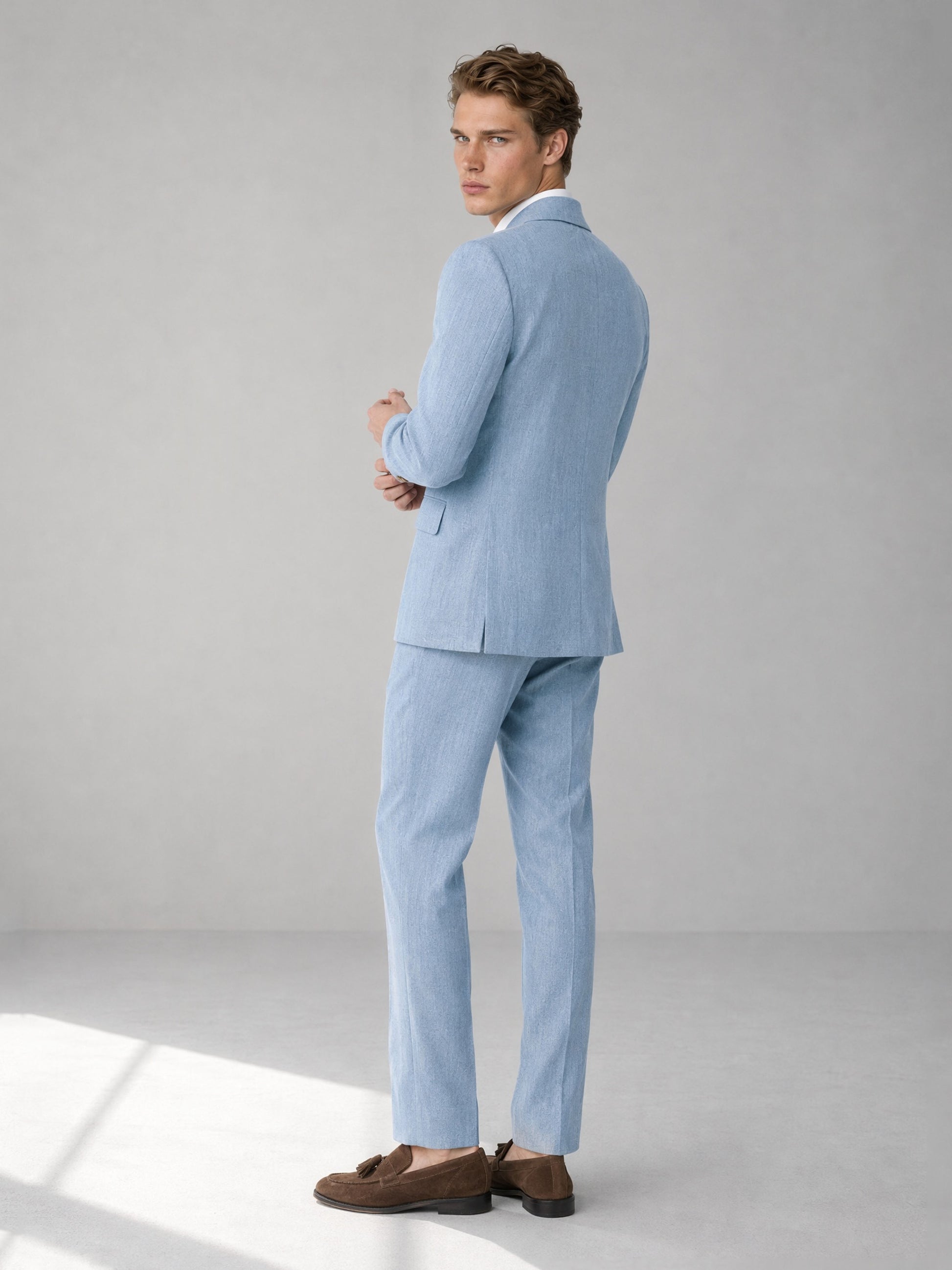Savile sky blue linen double-breasted suit – full-length front view, standing straight showing wide peak lapels and gold-tone metal buttons