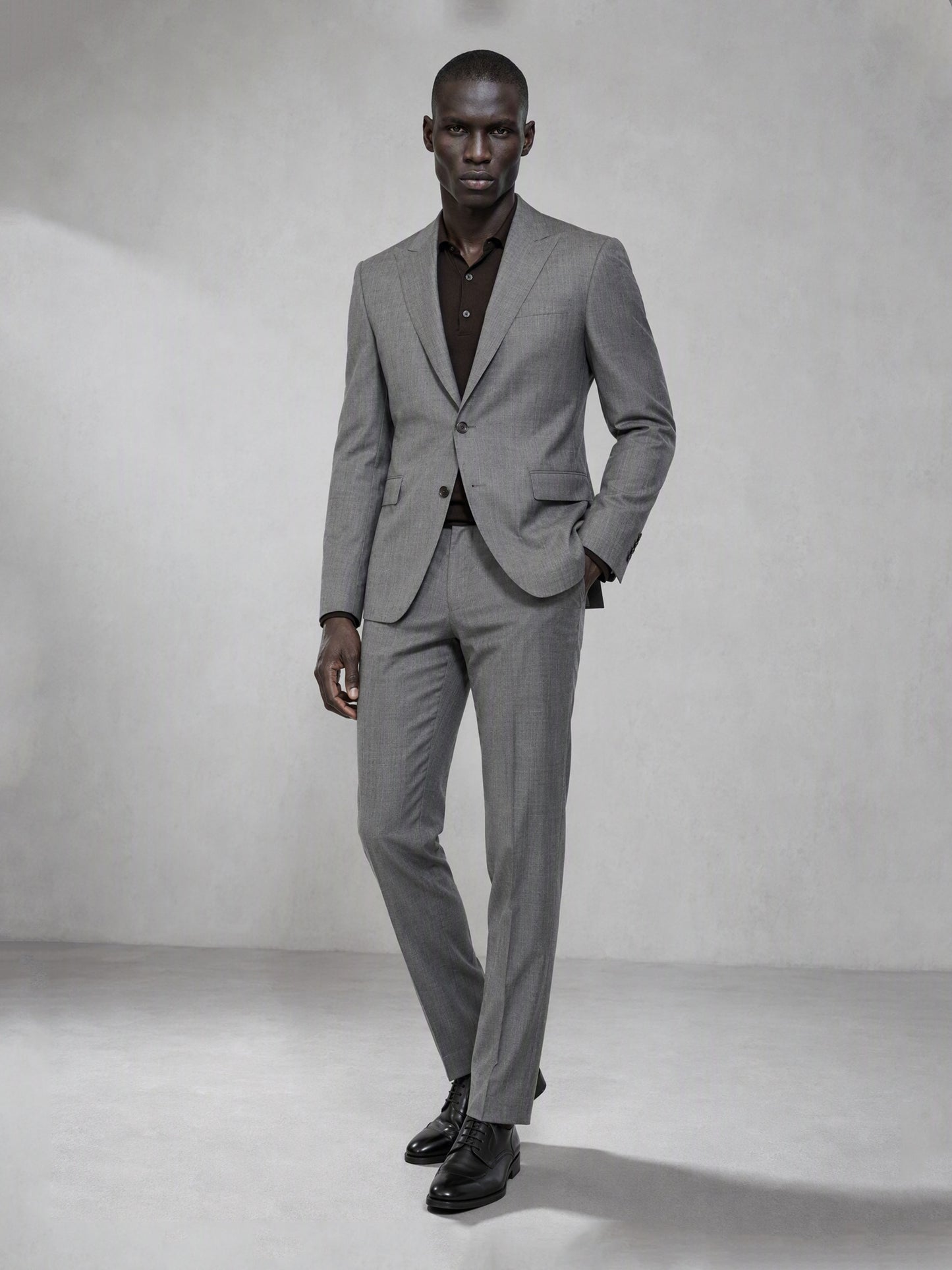 Savile grey wool blend suit – close-up upper body front, notch lapels, dark brown buttons and fine micro-texture weave detail