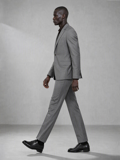 Savile grey wool blend suit – back view showing center vent, structured shoulder and clean tapered trouser silhouette
