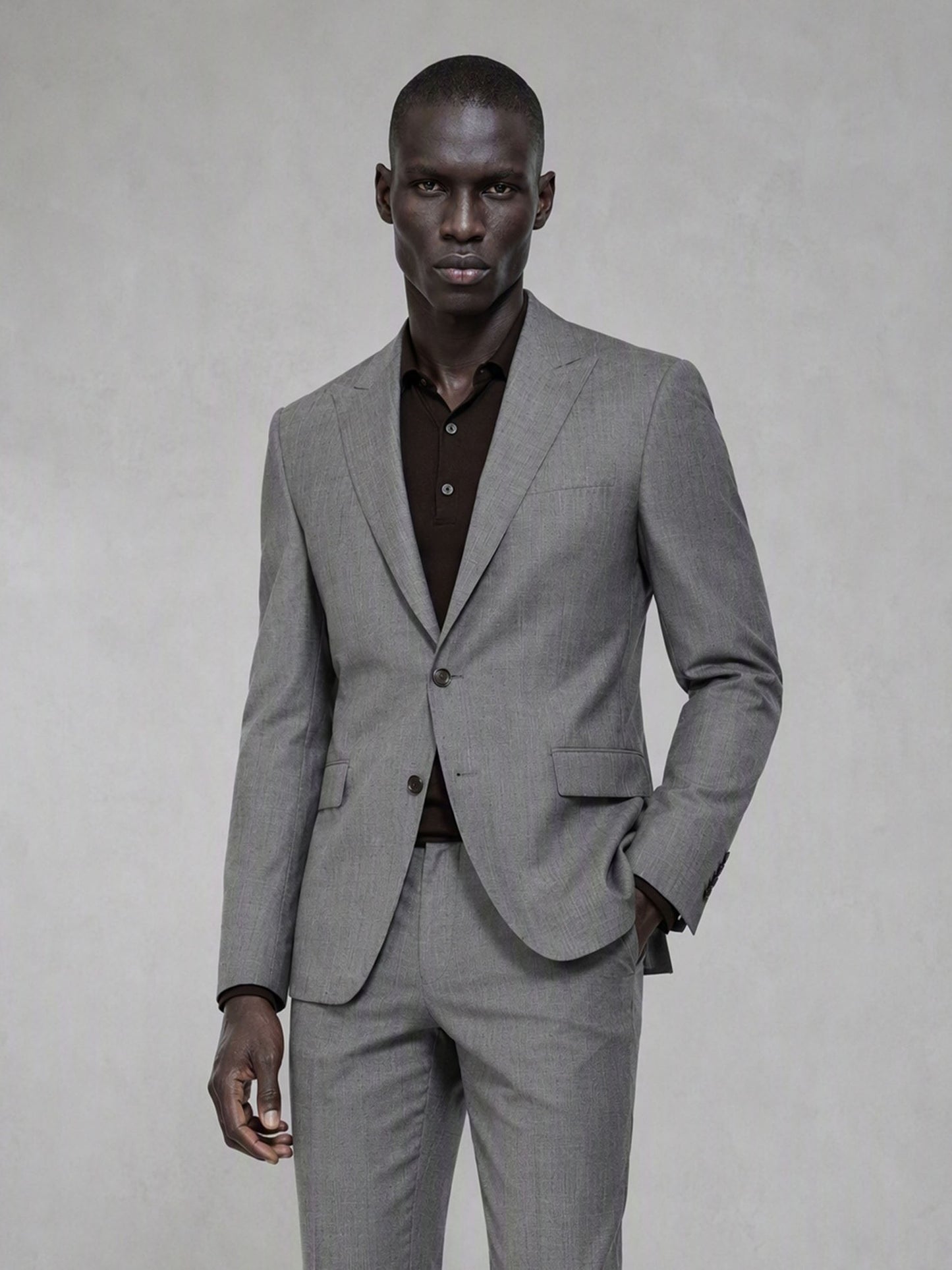 Savile grey wool blend suit – full-length side walking shot showing slim fit profile and black brogue oxfords