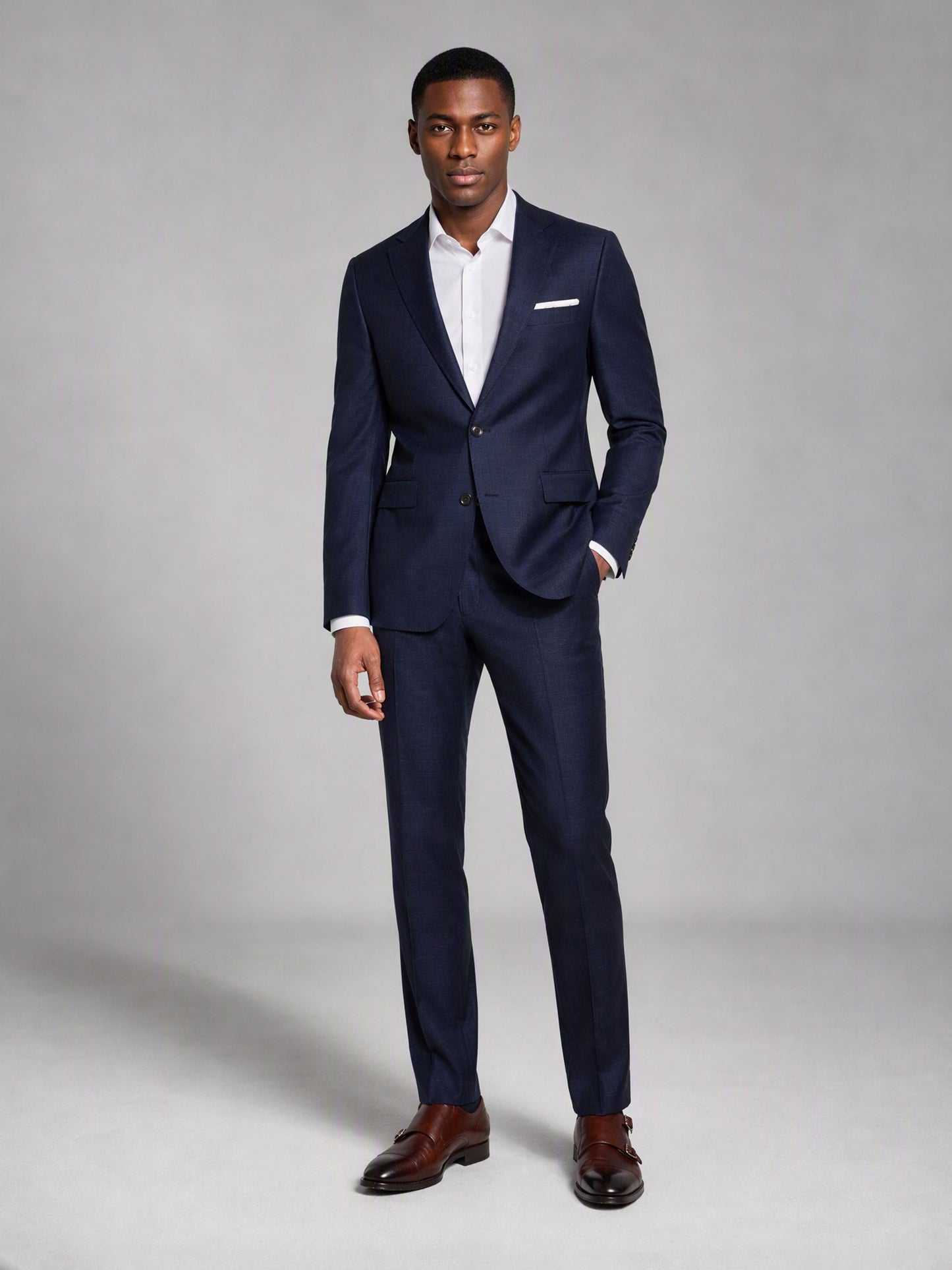 Savile deep navy slim fit suit – full-length front view, standing straight showing complete slim fit silhouette and brown monk-strap shoes