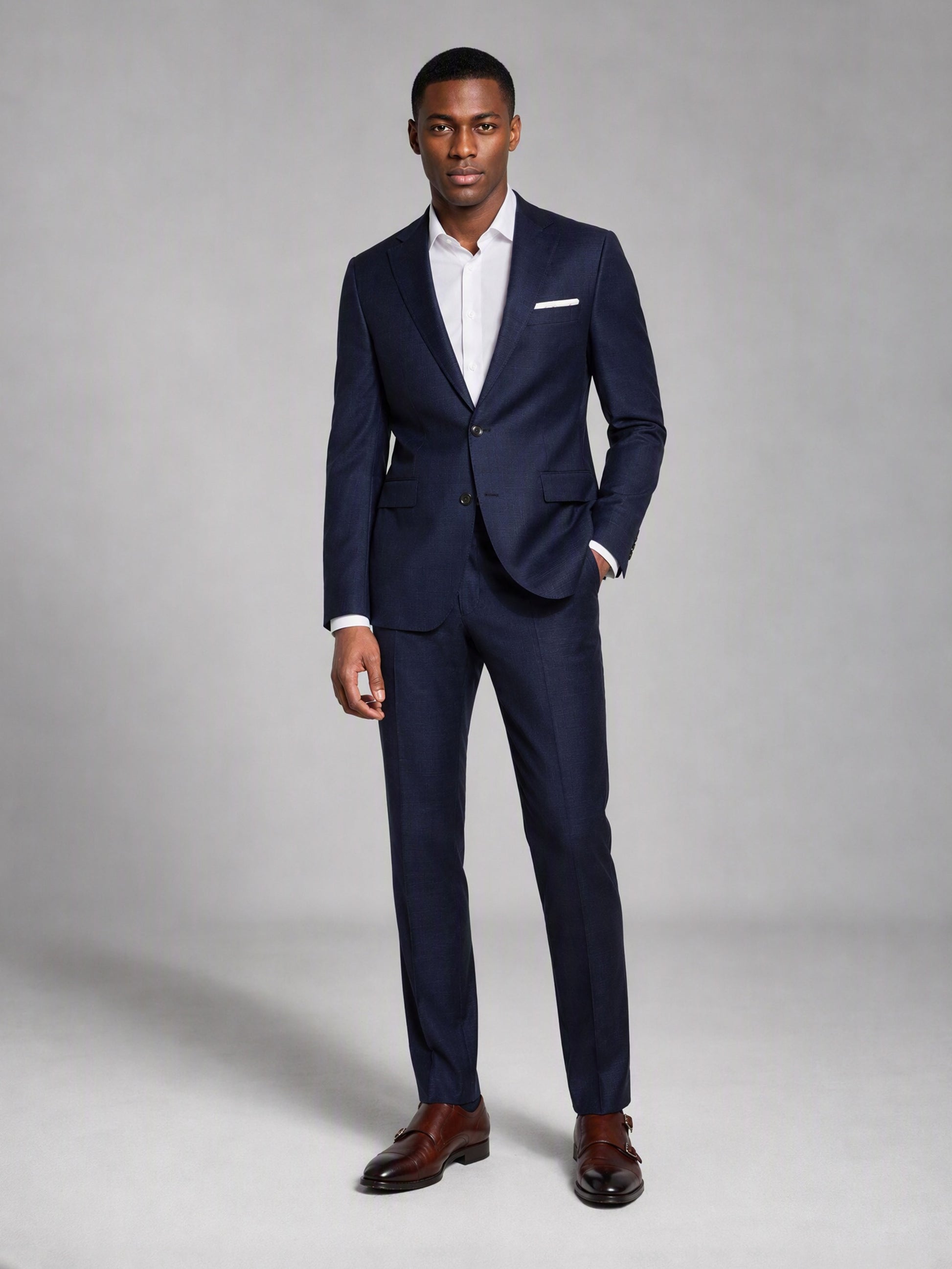 Savile deep navy slim fit suit – full-length front view, standing straight showing complete slim fit silhouette and brown monk-strap shoes